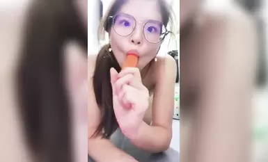 Contrast girl with long legs and glasses · Uses carrot to tease herself in bathroom